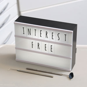 ‘Interest Free’ on illuminated board in dental treatment room