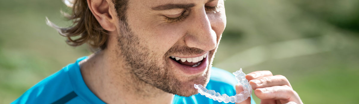Man with Invisalign retainer in Wrexham