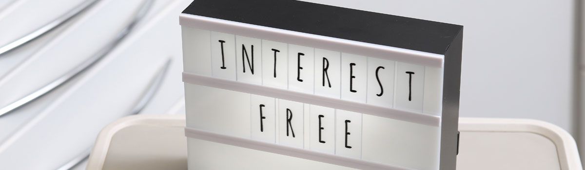 ‘Interest Free’ on illuminated board in dental treatment room