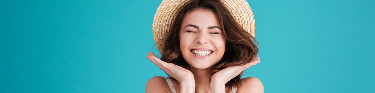 Woman smiling with eyes closed