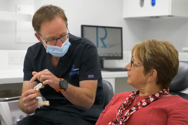 Wrexham dentist explaining Invisalign to patient